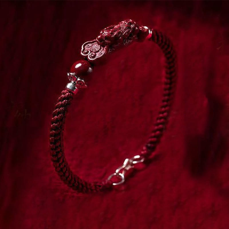 Handcrafted PiXiu Cinnabar Wealth Luck Braided Bracelet – dark red cinnabar PiXiu on red velvet, feng shui bracelet