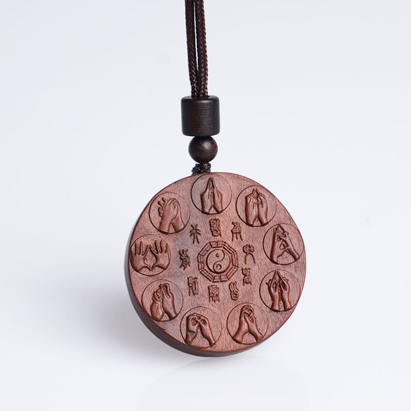 Lightning Struck Jujube Wood Pendant – Clean white background hero shot of round carved wooden pendant with yin-yang bagua, e
