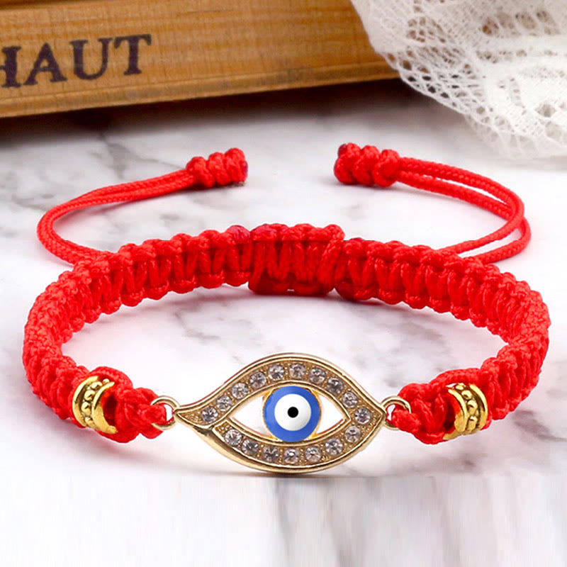 Red cord evil eye bracelet with gold blue evil eye crystal pave charm, marble photo