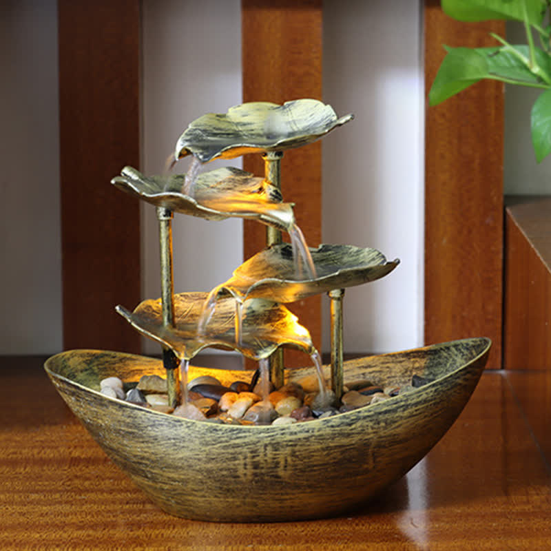 Lotus Leaf LED Waterfall Fountain - bronze patina tiers with warm glow on wooden panels, feng shui decor