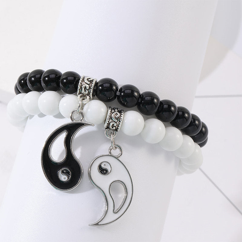 Yin Yang Protection Couple Bracelet - Matching beaded bracelets displayed on stand, black onyx white turquoise with yin-ya...