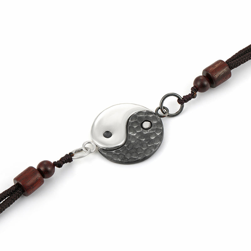 Sterling Silver Yin Yang Pendant - Two hands holding round textured yin-yang pendant on black cord, couples gift necklace