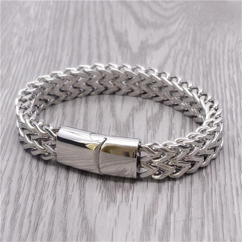 Fish Scale Titanium Steel Magnetic Bracelet – silver chain with box clasp on light wood-grain surface, polished finish detail