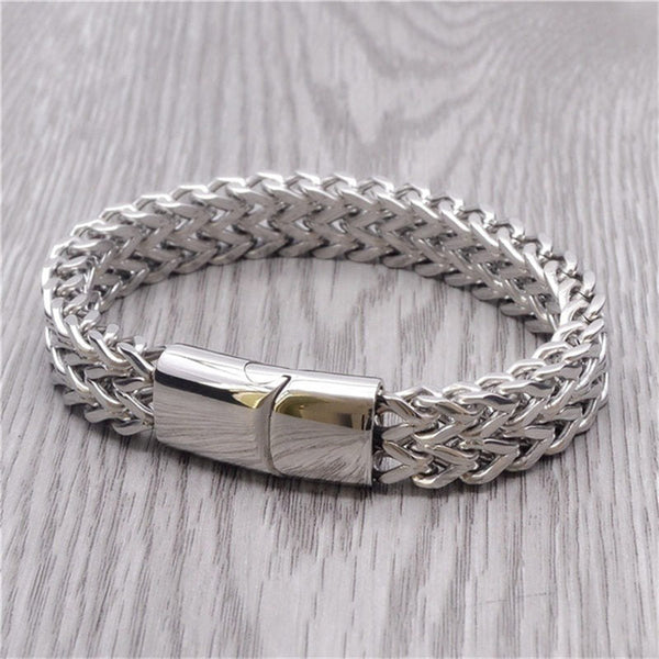 Fish Scale Titanium Steel Magnetic Bracelet – silver chain with box clasp on light wood-grain surface, polished finish detail