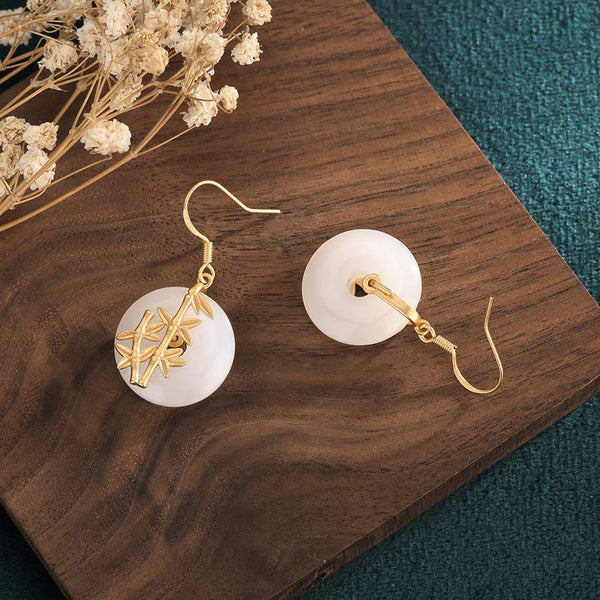 FengShui White Jade Fortune Earrings back view on wood surface