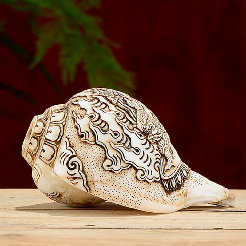 Engraved Shankha Wealth Conch – held over bronze offering bowl showing ritual use, Buddhist practice