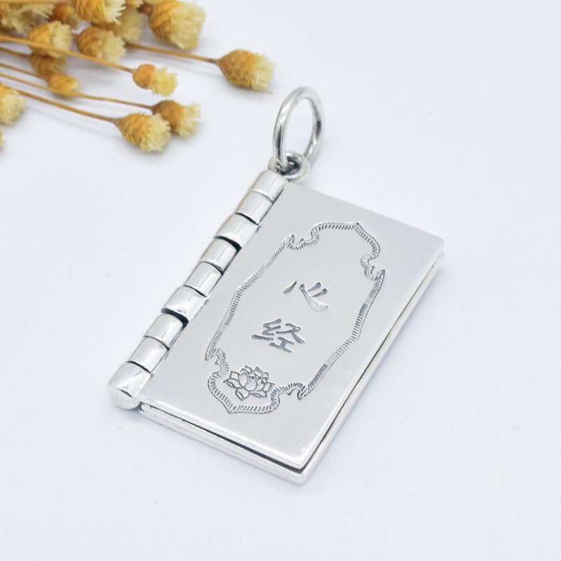 Sterling Silver Heart Sutra Pendant – Book charm with engraved lotus on black cord, mindfulness