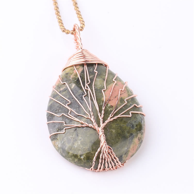 Quartz Crystal Tree of Life Necklace – unakite green pink pendant, copper wire tree, white background, balance
