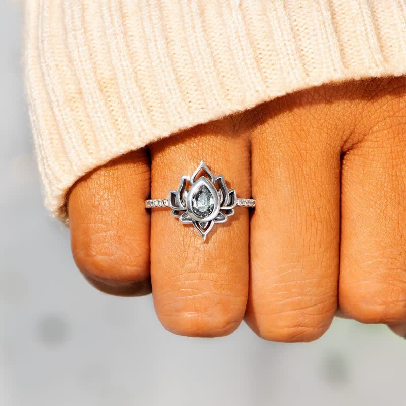 Sterling Silver Lotus Ring – Clear zircon on hand with cream sweater cuff, statement ring