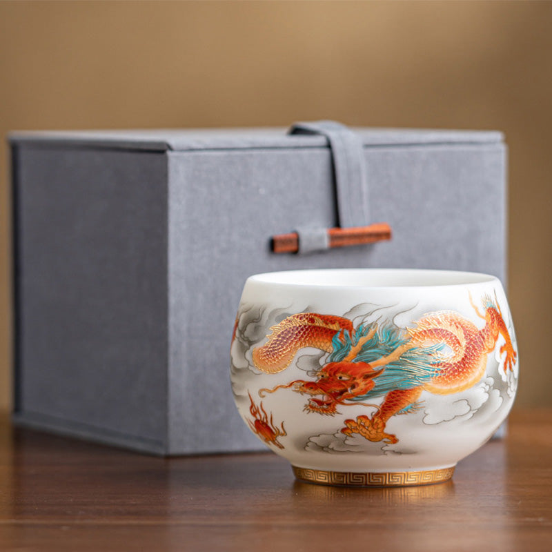 Dragon Phoenix Clouds Ceramic Teacup Gift Set – Orange-red dragon with gold scales on fabric box, wooden toggle, warm wood