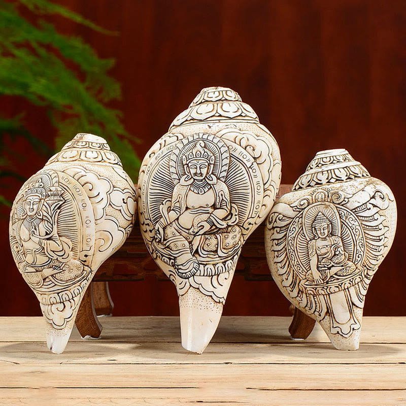 Engraved Shankha Wealth Conch – close-up of Buddha hand gesture holding jewel, mudra detail carving