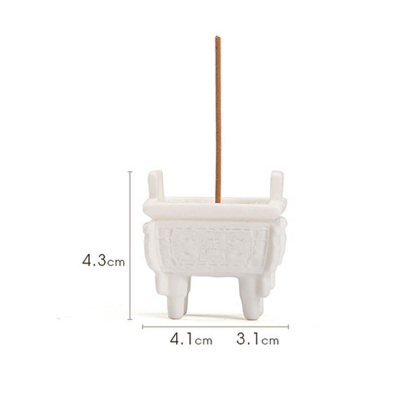 Dragon Ceramic Incense Burner – tripod censer with smoke on dark fabric, minimalist storage, peaceful