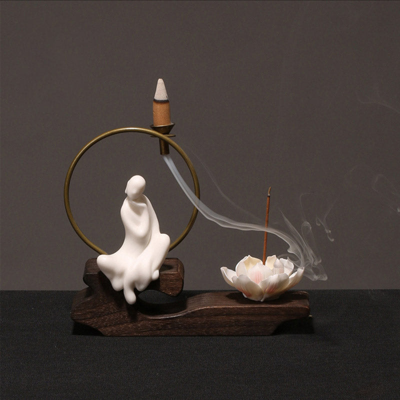 Ceramic Lotus Incense Burner – white robes, smoke to lotus bloom, brass ring, mindful