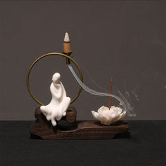 Ceramic Lotus Incense Burner – white robes, smoke to lotus bloom, brass ring, mindful