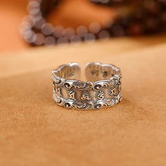 Tibetan Om Mani Padme Hum Ring – Low angle of adjustable cuff showing mantra text and scrollwork borders, antique silver ring