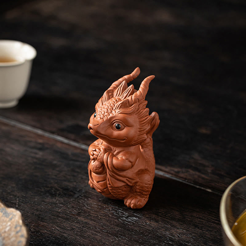 Luck Dragon Purple Clay Tea Pet - tea poured over dragon with brush care inset, ritual