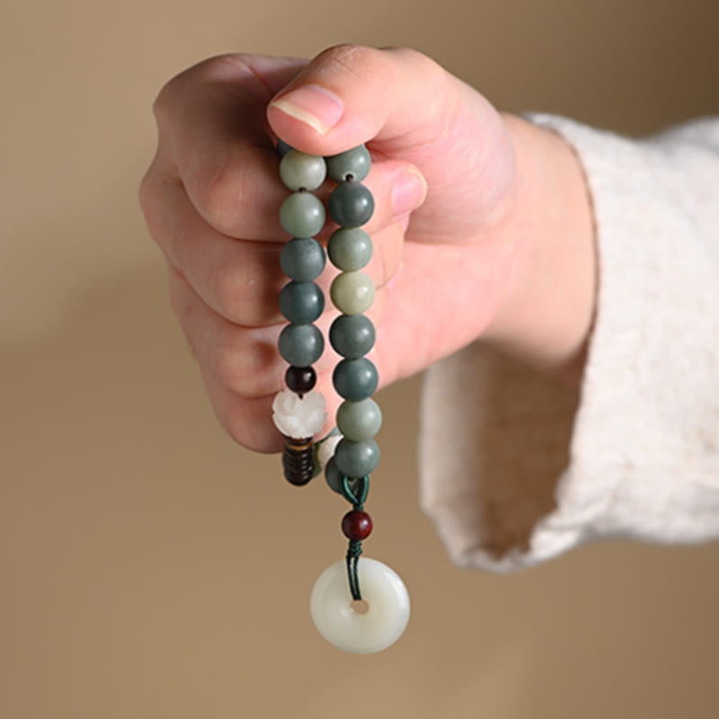 Cyan Bodhi Seed Jade Peace Buckle Bracelet - dangling green beads from hand, spiritual jewelry detail