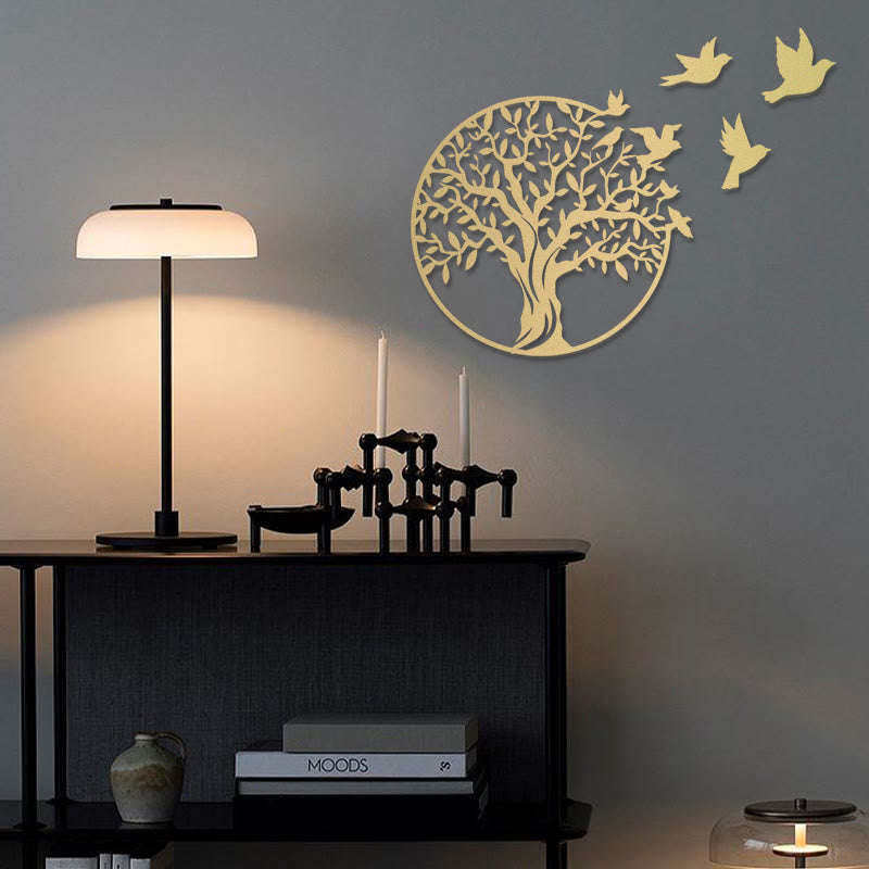 Tree of Life Birds Metal Wall Art - gold tree with birds on gray wall above black console table with warm lamp