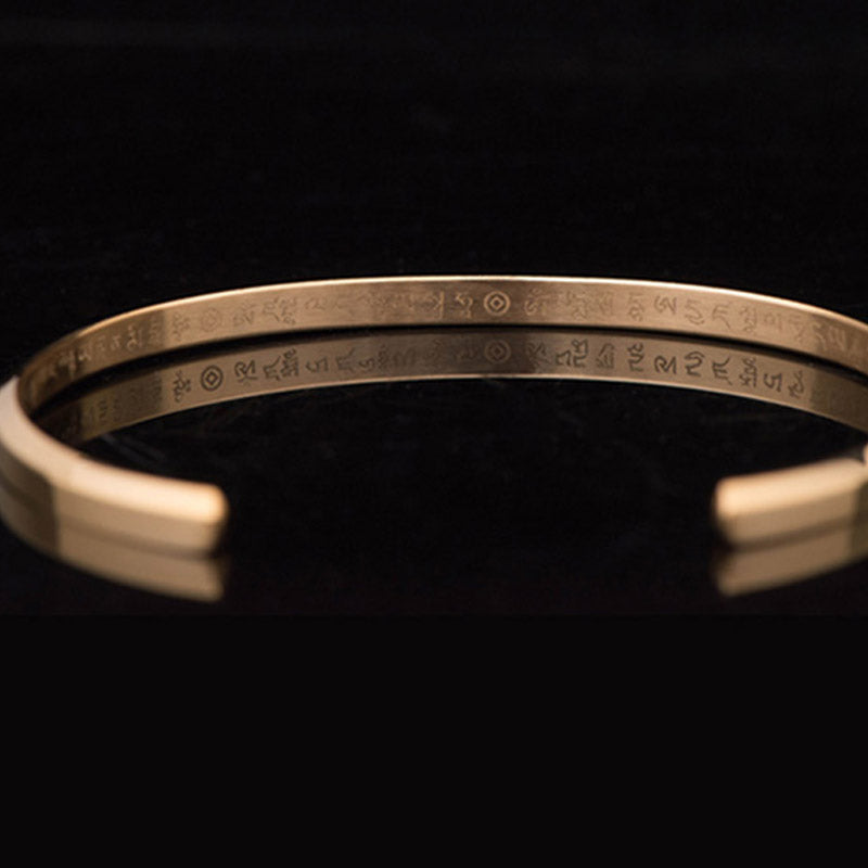 Om Mani Padme Hum Engraved Bracelet – gold cuff showing Tibetan script on both surfaces, dual engraving
