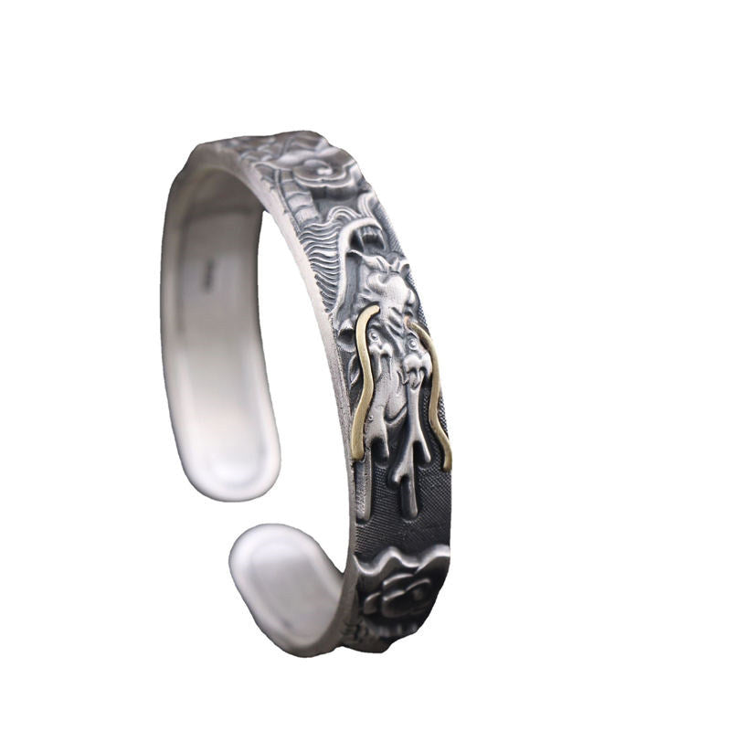 Sterling Silver Dragon Bangle – Full side profile on white background showing smooth interior, Bold