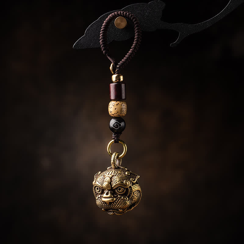 Pixiu Wealth Copper Key Chain – hanging dark background with rope loop, wooden and black beads, copper pixiu talisman