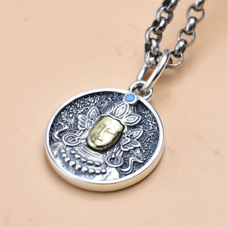 925 Sterling Silver Green Tara Necklace - Flat lay pendant on beige surface, detailed metalwork closeup
