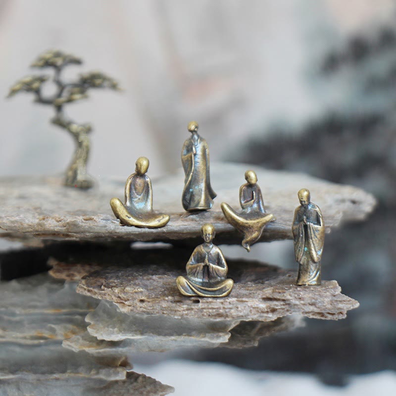 Mini Metal Meditation Buddha Decoration – five bronze monk figurines on layered zen rocks with pine tree, serenity and peace