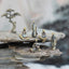 Mini Metal Meditation Buddha Decoration – five bronze monk figurines on layered zen rocks with pine tree, serenity and peace