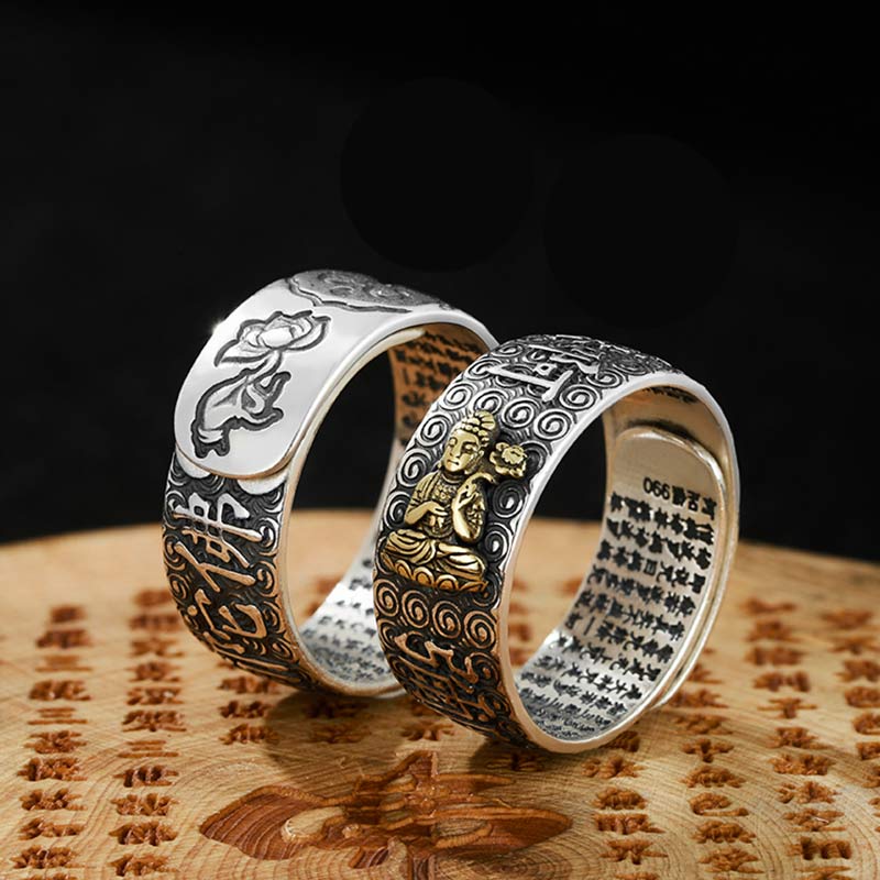 Natal Buddha Ring - Two rings upright on carved wood showing Buddha relief, Prosperous