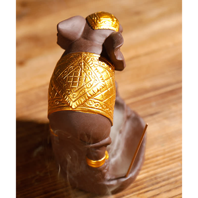 Elephant Incense Burner Close-up – Low angle showing smoke waterfall pooling in lotus reservoir at base, zen decor