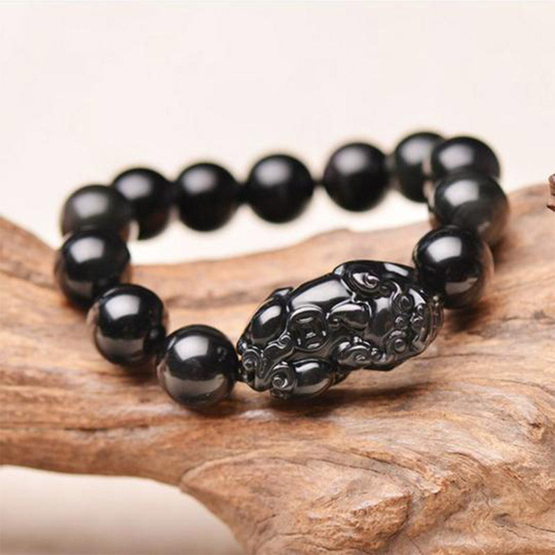 PiXiu Obsidian Bracelet – Black obsidian beads with carved PiXiu on driftwood, wealth protection
