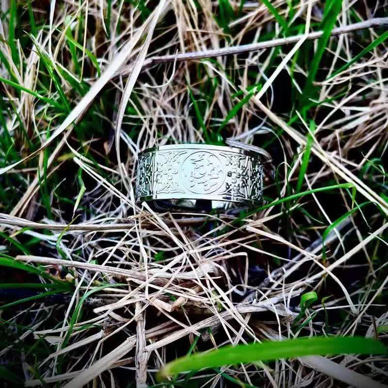Four Guardian Beasts Ring – polished silver filigree on green grass, Rustic