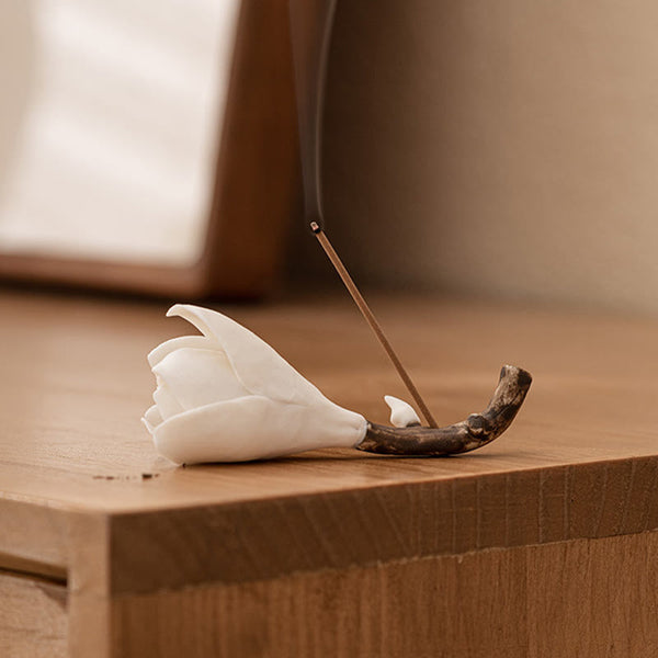 Gardenia Ceramic Incense Burner – Burning incense stick with smoke on light wood, natural window light