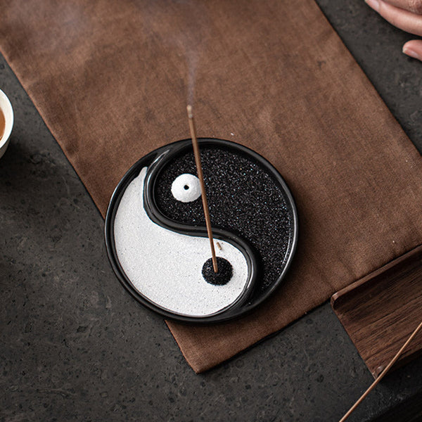 Yin Yang Incense Holder – Ceramic incense tray with rising smoke on brown fabric mat, Calm