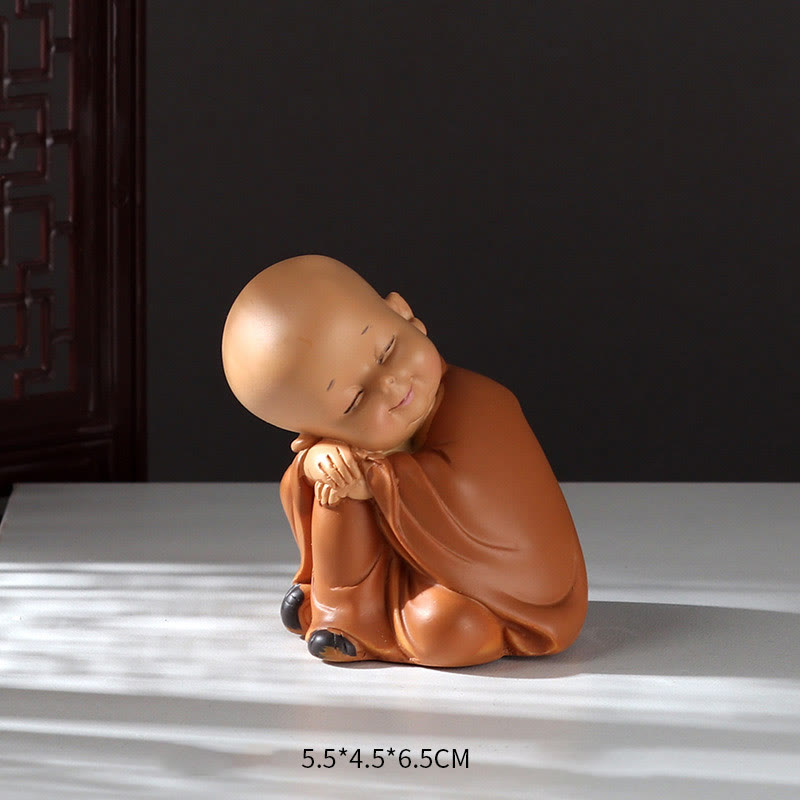 Mini Praying Monk Decor – size next to coffee cup showing mini scale, desk friendly ornament