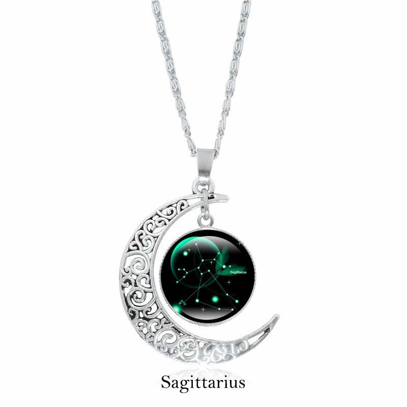 Zodiac Moon Protection Copper Necklace - Silver crescent moon with Sagittarius constellation cabochon in glowing green aurora on black starry background