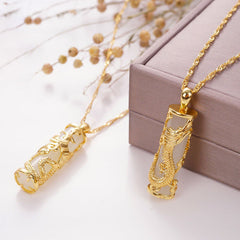 Jade Dragon Phoenix Copper Pendant – Gold dragon cage holding white jade cylinder on rope chain, elegant