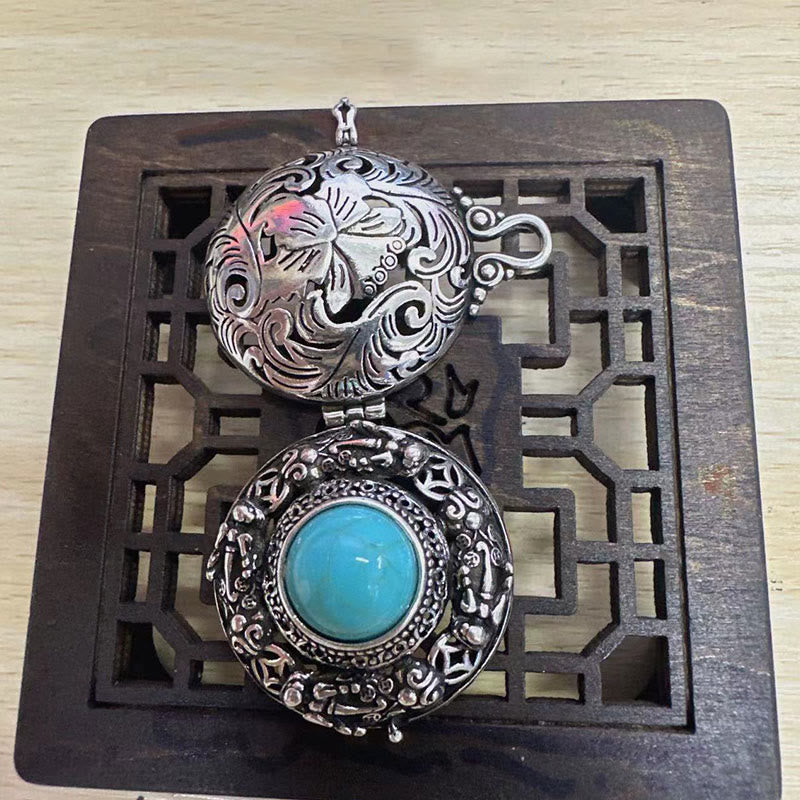 Tibetan Pi Xiu Necklace – Open locket showing Pi Xiu engraving and turquoise stone