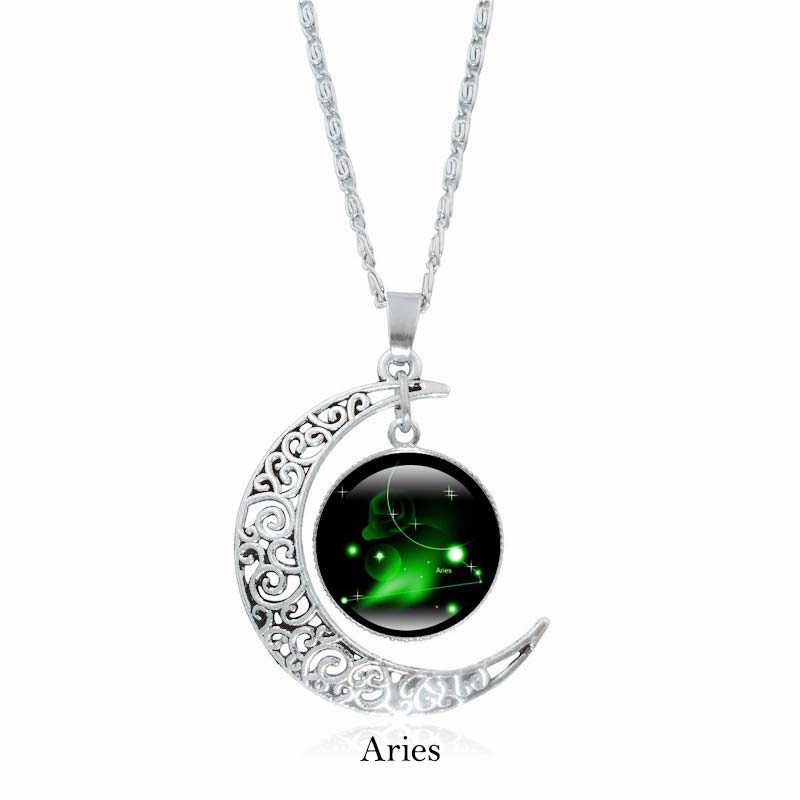 Zodiac Moon Protection Copper Necklace - Silver crescent moon with Aries zodiac constellation cabochon in green nebula glow on black starry background
