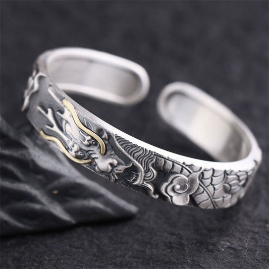 Sterling Silver Dragon Bangle – Detailed dragon head with gold horn inlay on dark stone, Protection