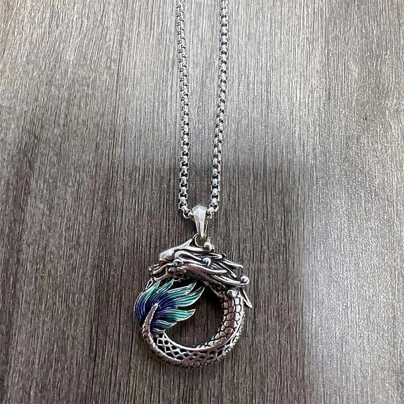 Tibetan Copper Dragon Necklace - Top-down on wood grain, enameled dragon on chain, Artisan