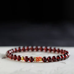 999 Gold Koi Fish Bracelet – close-up koi fish pendant texture, garnet stone, 999 gold koi charm