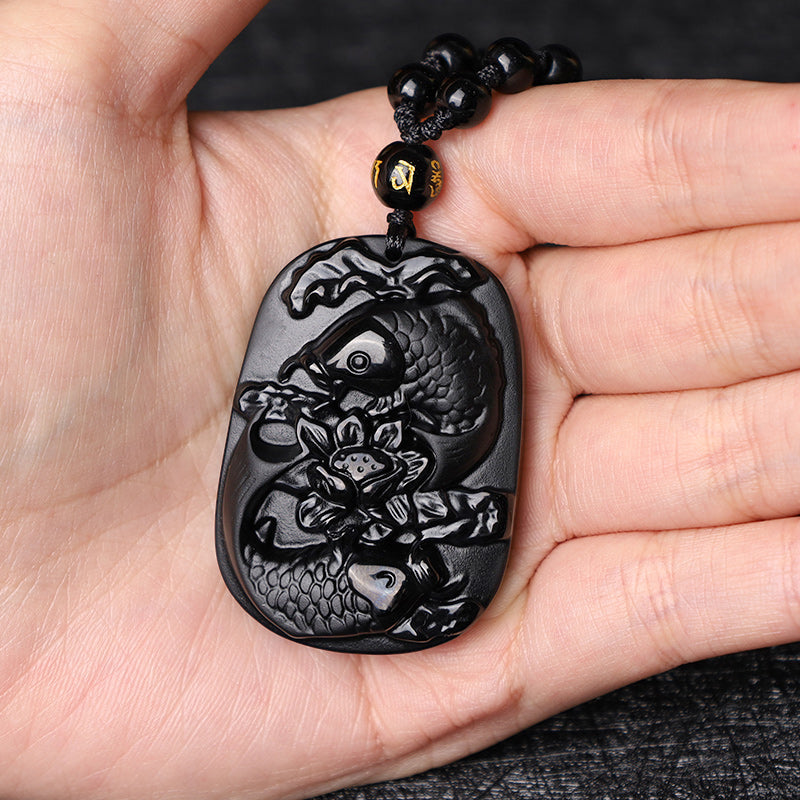 Black Obsidian Koi Fish Lotus Beaded Necklace – macro detail of obsidian bead polish and luster, gemstone beads