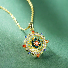 Sterling Silver Lotus Zircon Pendant with multicolor stones on teal fabric, spiritual