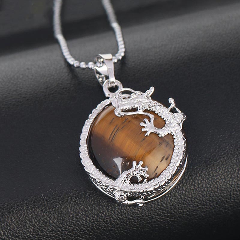Dragon Multi-Stone Crystal Healing Pendant – Tiger eye dragon on leather with warm amber glow, bold