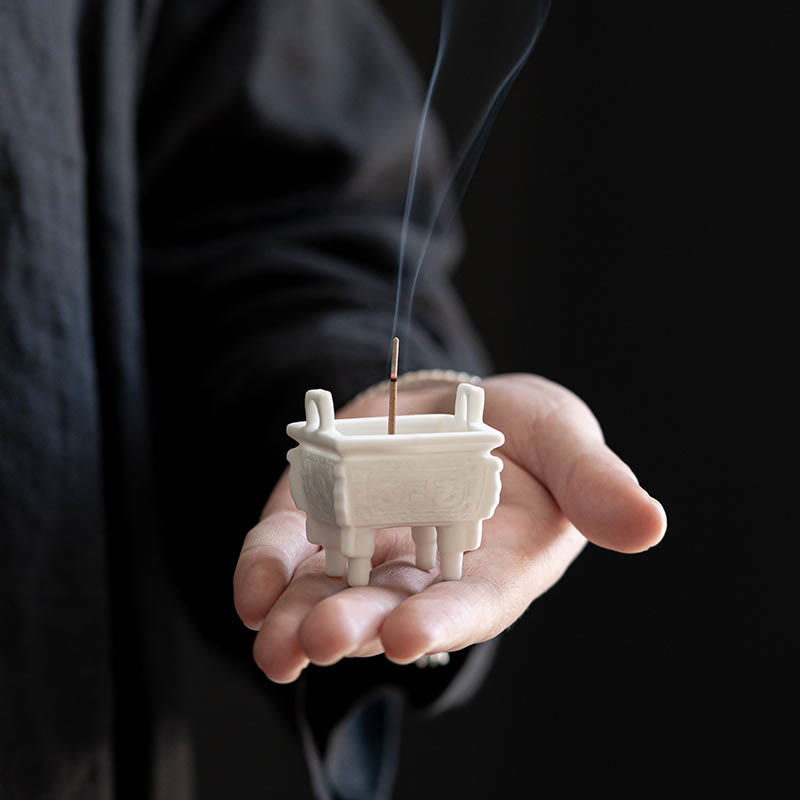 Dragon Ceramic Incense Burner – handheld ding vessel with rising smoke, palm-sized, meditative