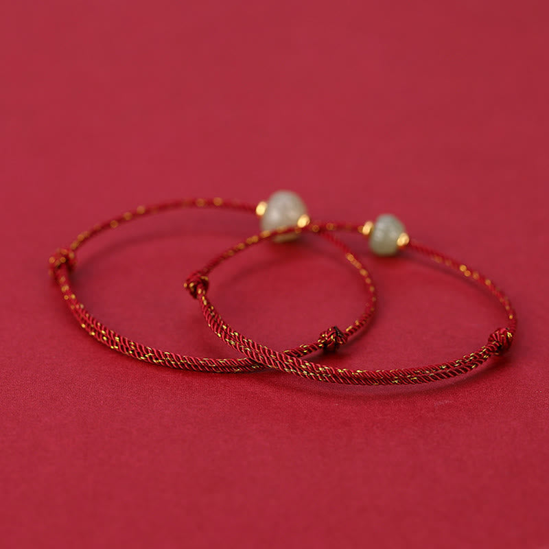 Hetian Jade Lotus Red String Bracelet - Two bracelets on solid red background, smooth jade with gold spacers, protection