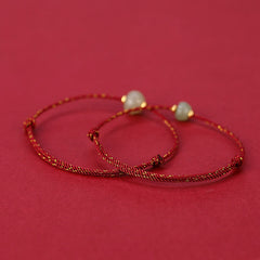 Hetian Jade Lotus Red String Bracelet - Two bracelets on solid red background, smooth jade with gold spacers, protection