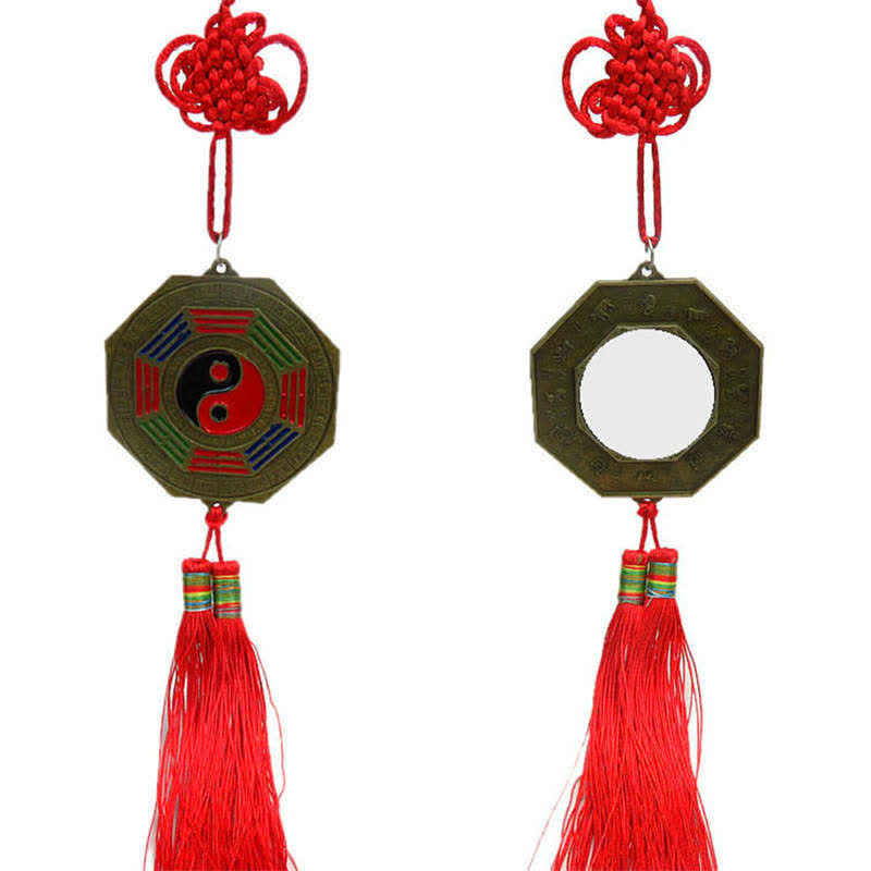 Feng Shui Bagua Map Mirror - Bagua mirror feng shui charm with red tassel and knot, bronze octagonal frame, yin-yang trigram.