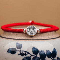 925 Sterling Silver Yin Yang Bagua Cinnabar Bracelet – Red cord with Bagua charm on blue porcelain stand, feng shui bracelet